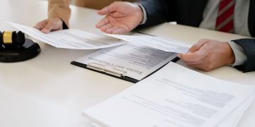 NORM FAZLASI ATAMA DUYURUSUNDA İLÇE GRUBU UYGULAMASINA DAVA AÇTIK